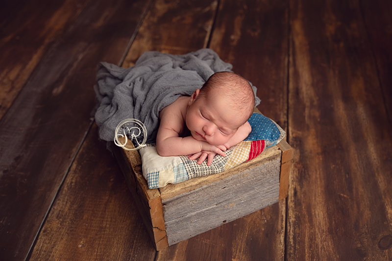 Newborn Boy in crate