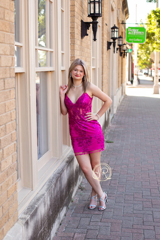 Downtown Fort Worth senior photo shoot with female teen to celebrate Homecoming.