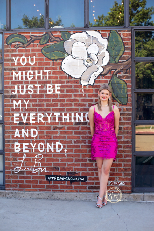 Downtown Fort Worth senior photo shoot with female teen to celebrate Homecoming.