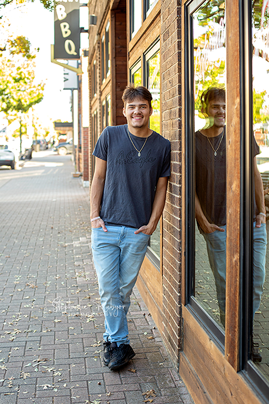 Stephanie Rubyor Photography has Weston posing for his senior pictures in downtown Fort Worth. 