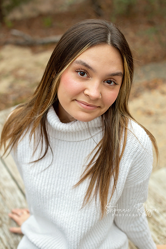 Beautiful senior Ava poses for a senior photo session at Eagle Mountain Park in Fort Worth. 