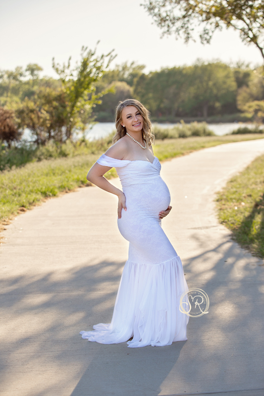 Maternity mama in white dress at Eagle Mountain Lake in Saginaw, Texas. 