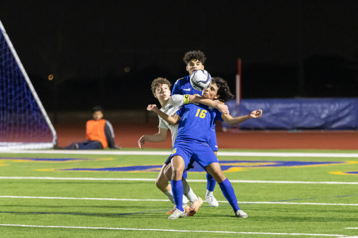 Soccer player at a Saginaw, Texas high school making a play on the ball.