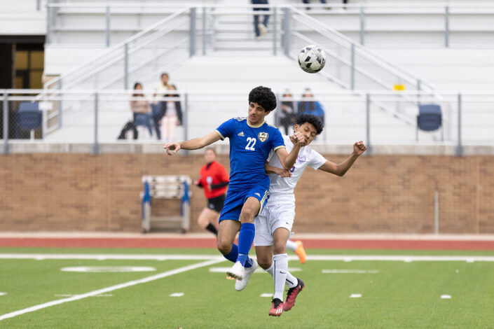 Soccer player at a Saginaw, Texas high school making a play on the ball.