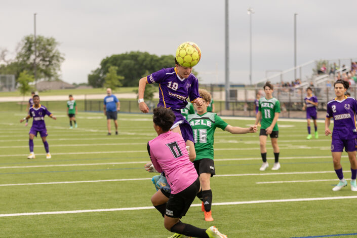 Soccer player at a Saginaw, Texas high school making a play on the ball.