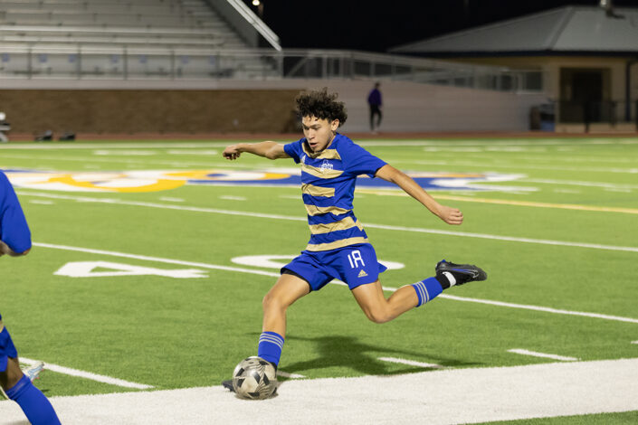 Soccer player at a Saginaw, Texas high school making a play on the ball.