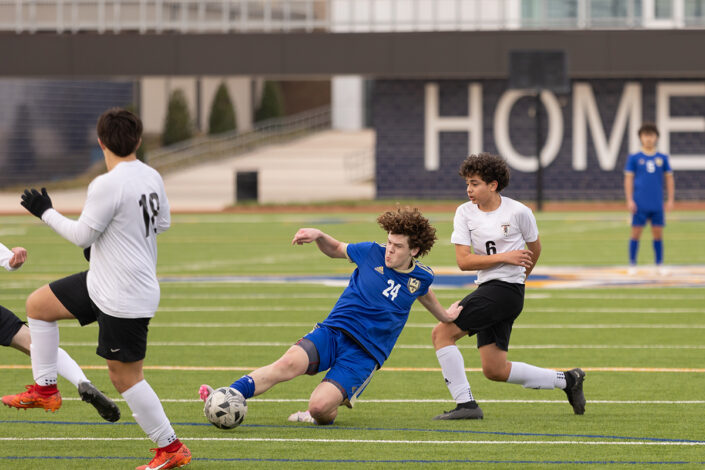 Soccer player at a Saginaw, Texas high school making a play on the ball.