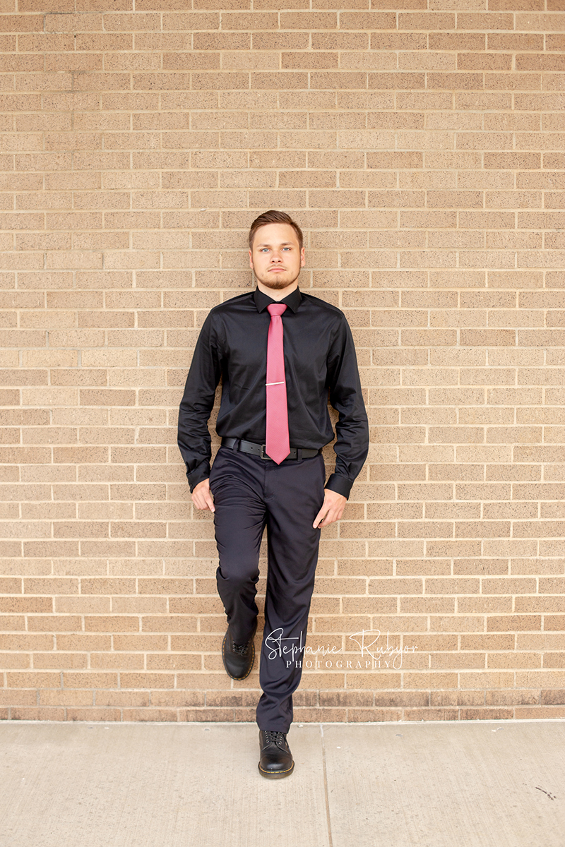 Senior boy dressed up for his photography session in Saginaw, TX.