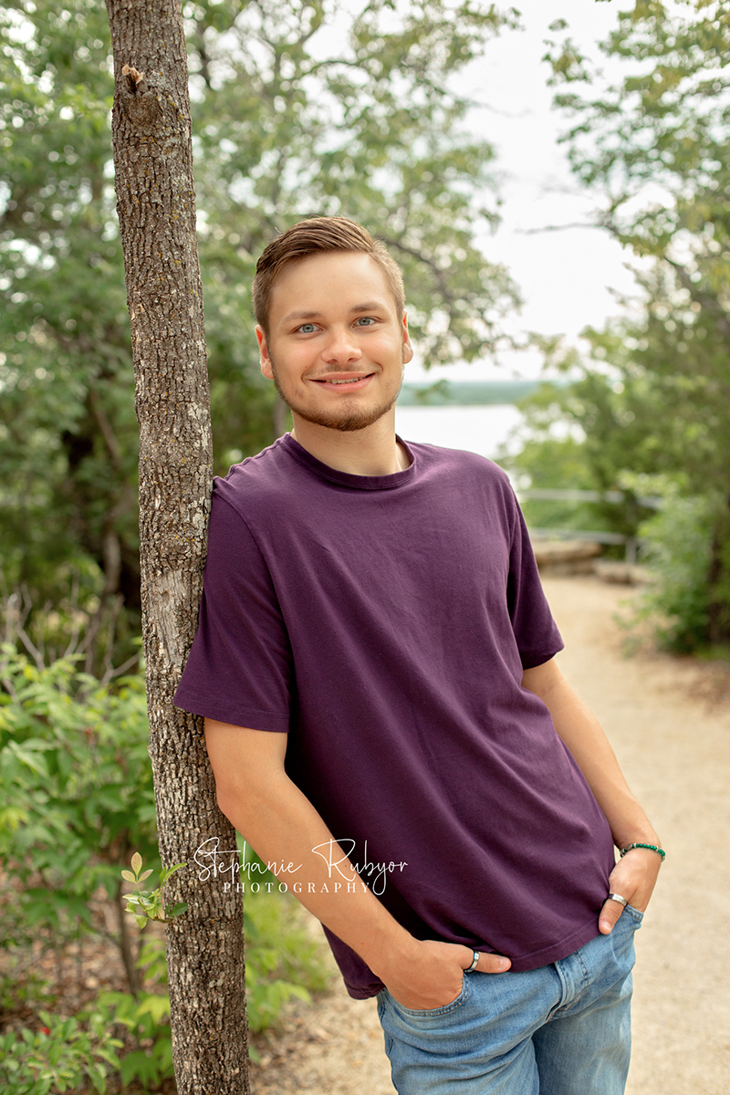 High school senior guy posing at a park in Lake Worth, Texas for a photo shoot. 