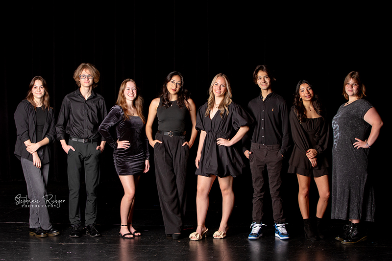 Theatre officers and high school seniors from Boswell High School in Fort Worth posing for a photo session on stage.