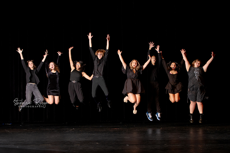 Theatre officers and high school seniors from Boswell High School in Fort Worth posing for a photo session on stage.