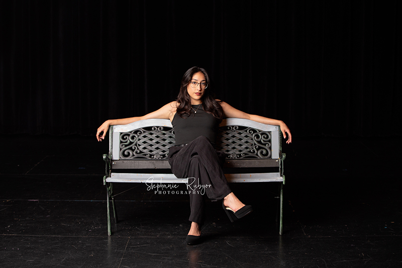 Theatre officers and high school seniors from Boswell High School in Fort Worth posing for a photo session on stage.