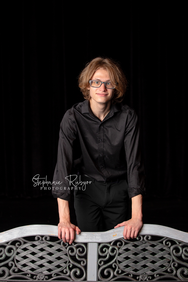 Theatre officers and high school seniors from Boswell High School in Fort Worth posing for a photo session on stage.