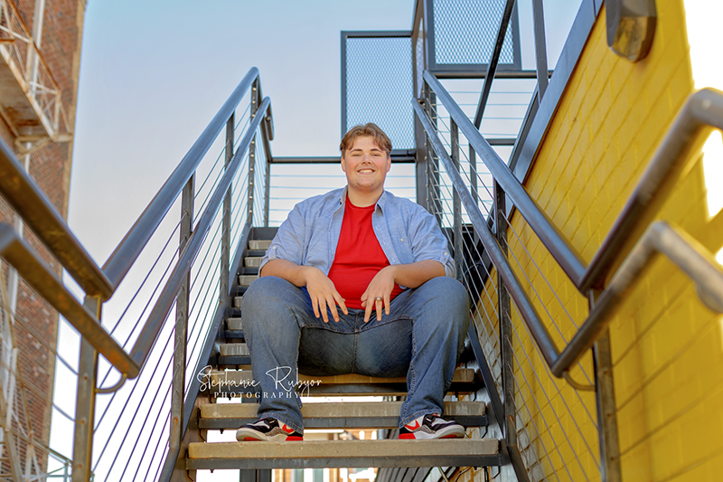 Fort Worth senior guy posing downtown for his senior pics.