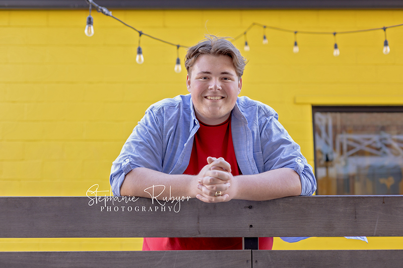 Fort Worth senior guy posing downtown for his senior pics. 