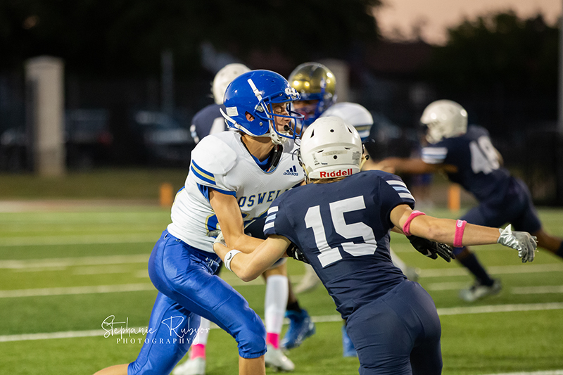 High school football player in Fort Worth, Texas playing a football game.