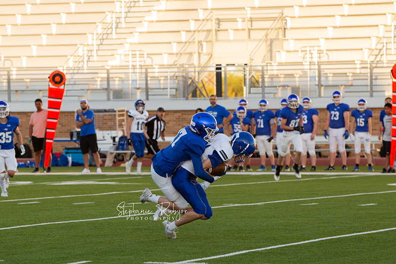 High school football player in Fort Worth, Texas playing a football game.