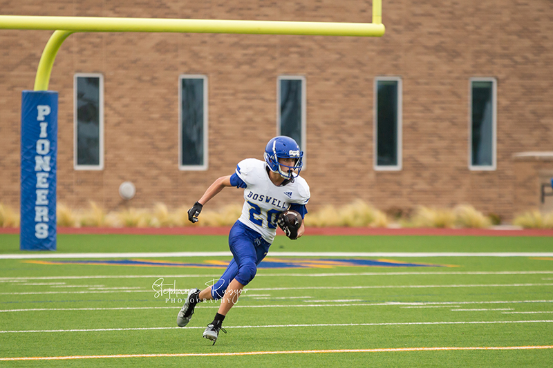 High school football player in Fort Worth, Texas playing a football game.