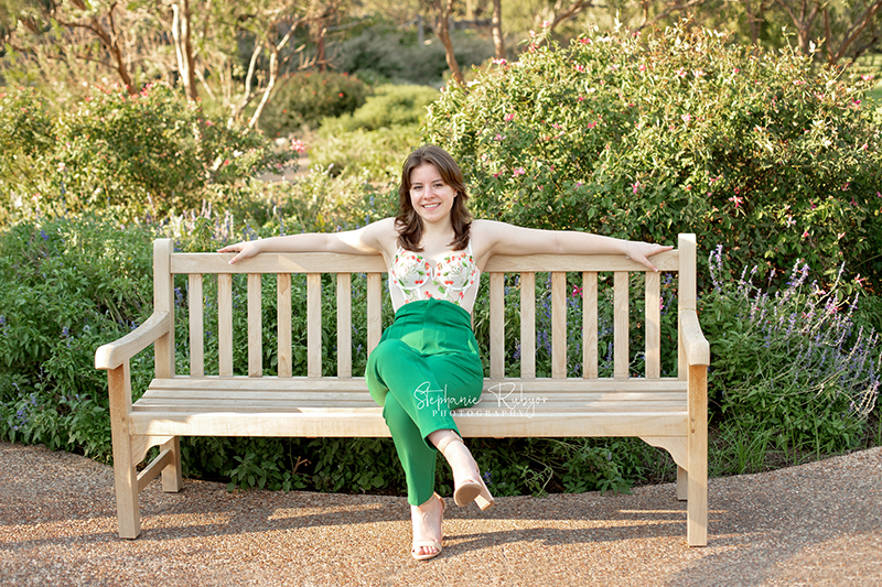 Reilly is posing for her senior session at the Fort Worth Botanic Gardens in the summer before her senior year.