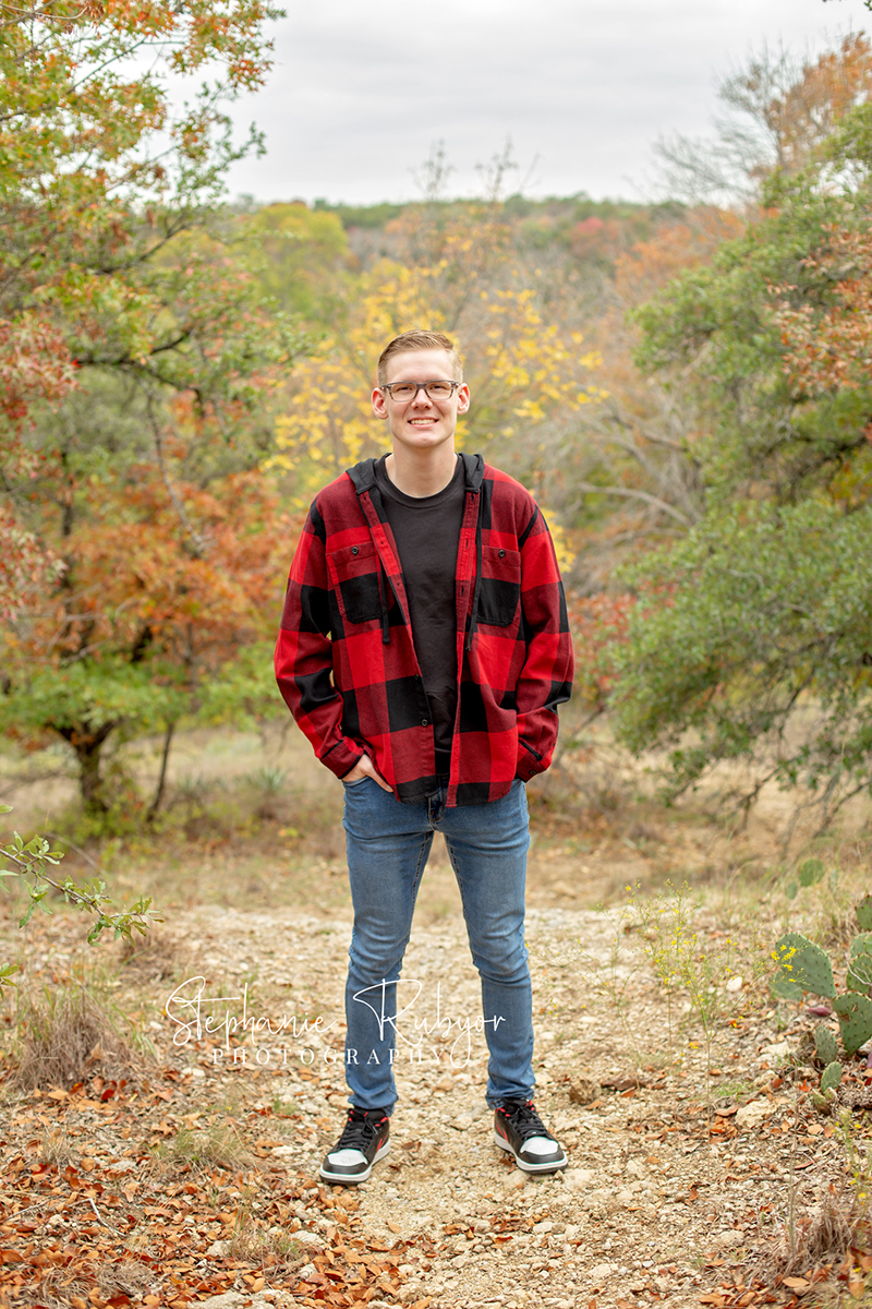 Senior guy from Las Vegas who came to Fort Worth posing for his senior pictures at Eagle Mountain Lake Park in Fort Worth, Texas. 
