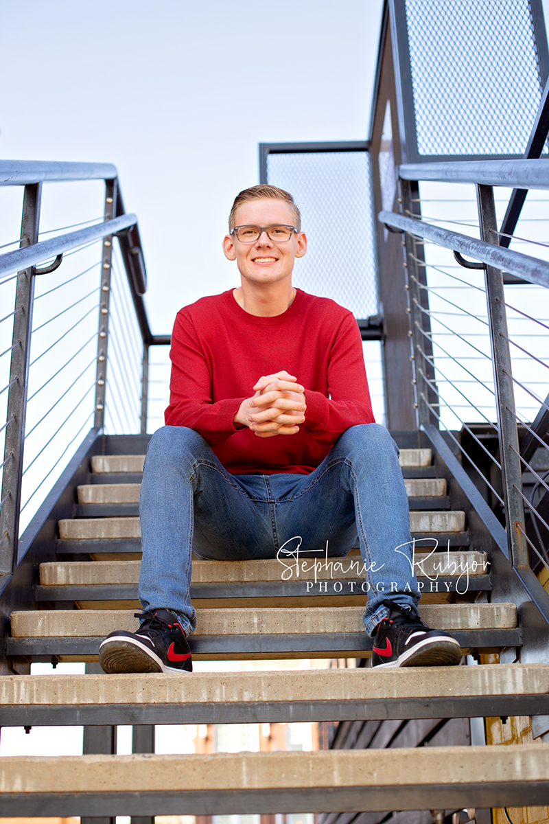 Senior guy from Las Vegas who came to Fort Worth posing for his senior pictures in downtown Fort Worth. 