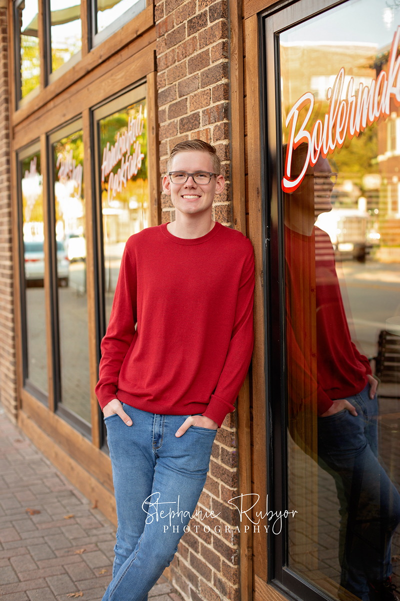 Senior guy from Las Vegas who came to Fort Worth posing for his senior pictures in downtown Fort Worth. 