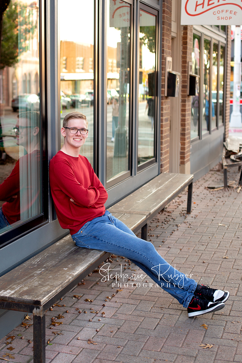 Senior guy from Las Vegas who came to Fort Worth posing for his senior pictures in downtown Fort Worth. 
