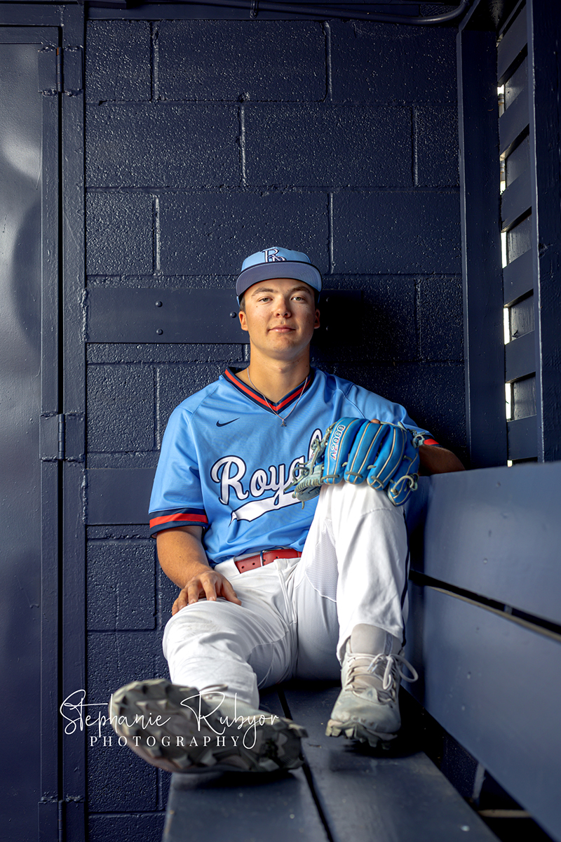 High school senior boy does some baseball sports portraits for his senior photo session in Richland Hills, Texas. 