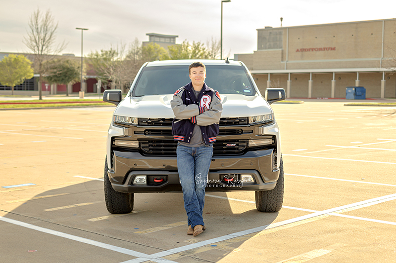 Richland Hills senior boy poses for pictures at a photo session at Richland Hills High School