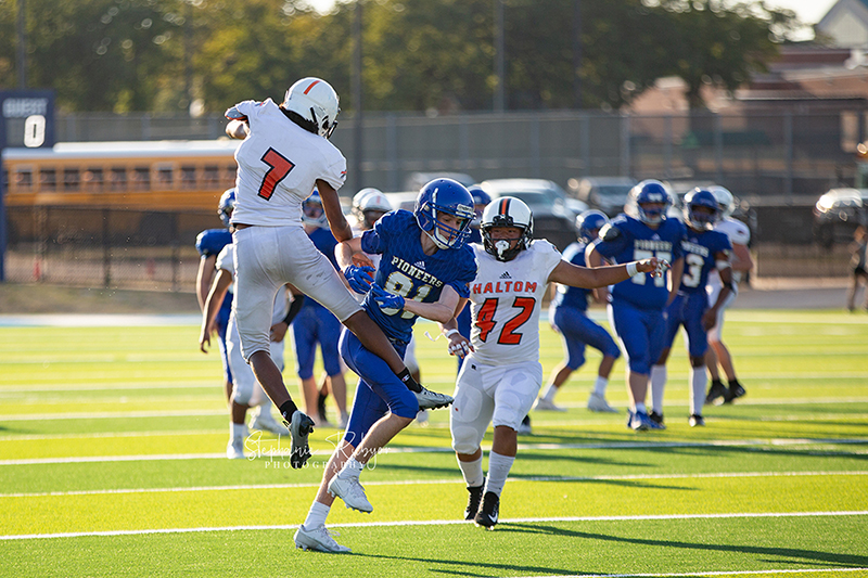 High school football player in Fort Worth, Texas playing a football game. 