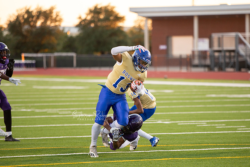 High school football player in Fort Worth, Texas playing a football game. 
