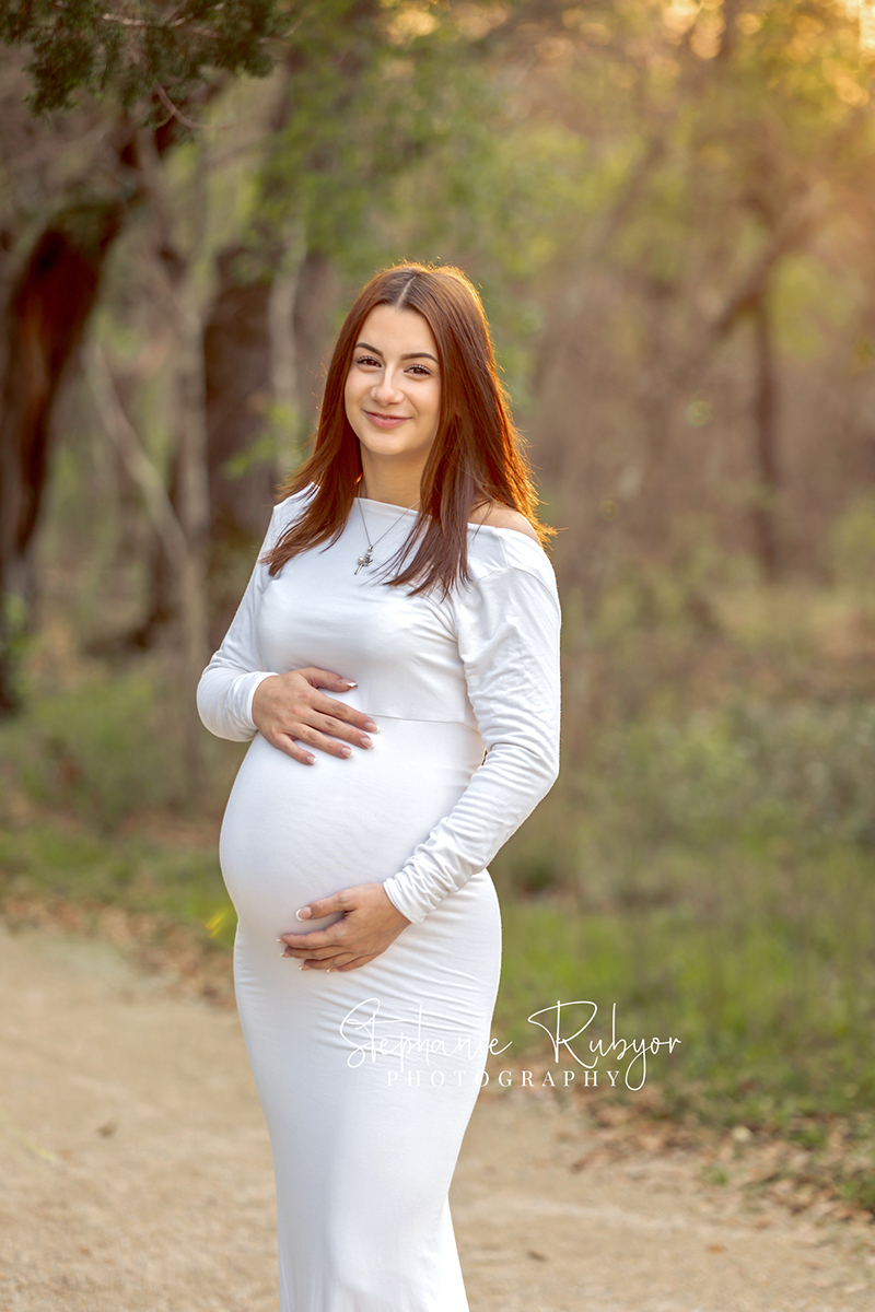 Rebecca posing for a maternity photography session at the park in Fort Worth, Texas. 