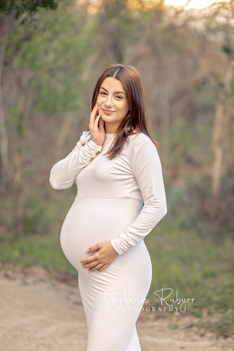 Rebecca posing for a maternity photography session at the park in Fort Worth, Texas. 
