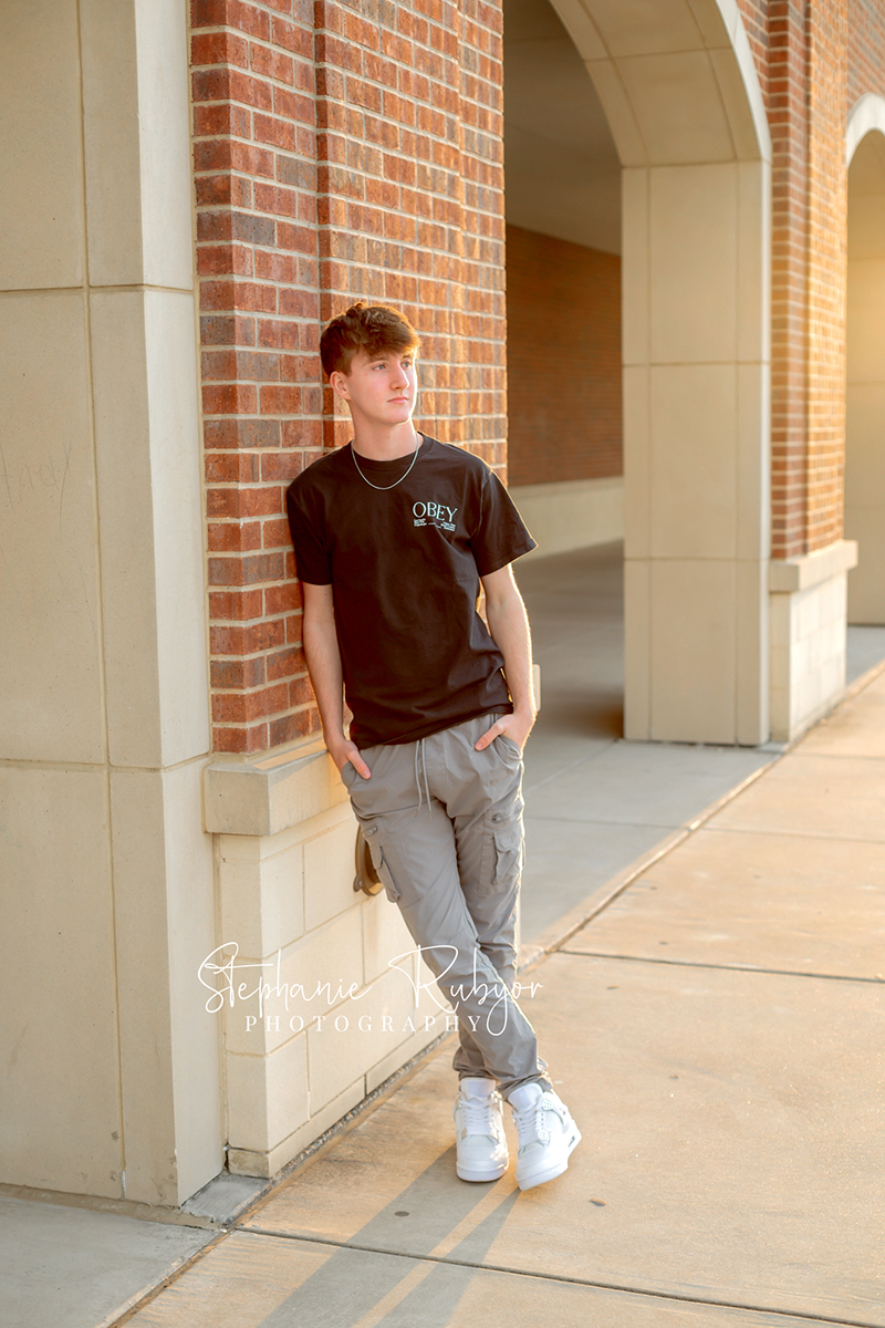 Brayden posing at Eaton High School in Haslet, Texas for his senior photo session. 