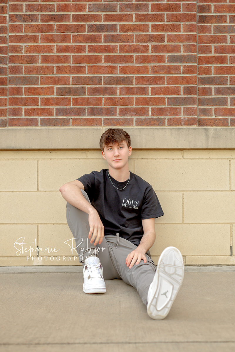 Brayden posing at Eaton High School in Haslet, Texas for his senior photo session. 