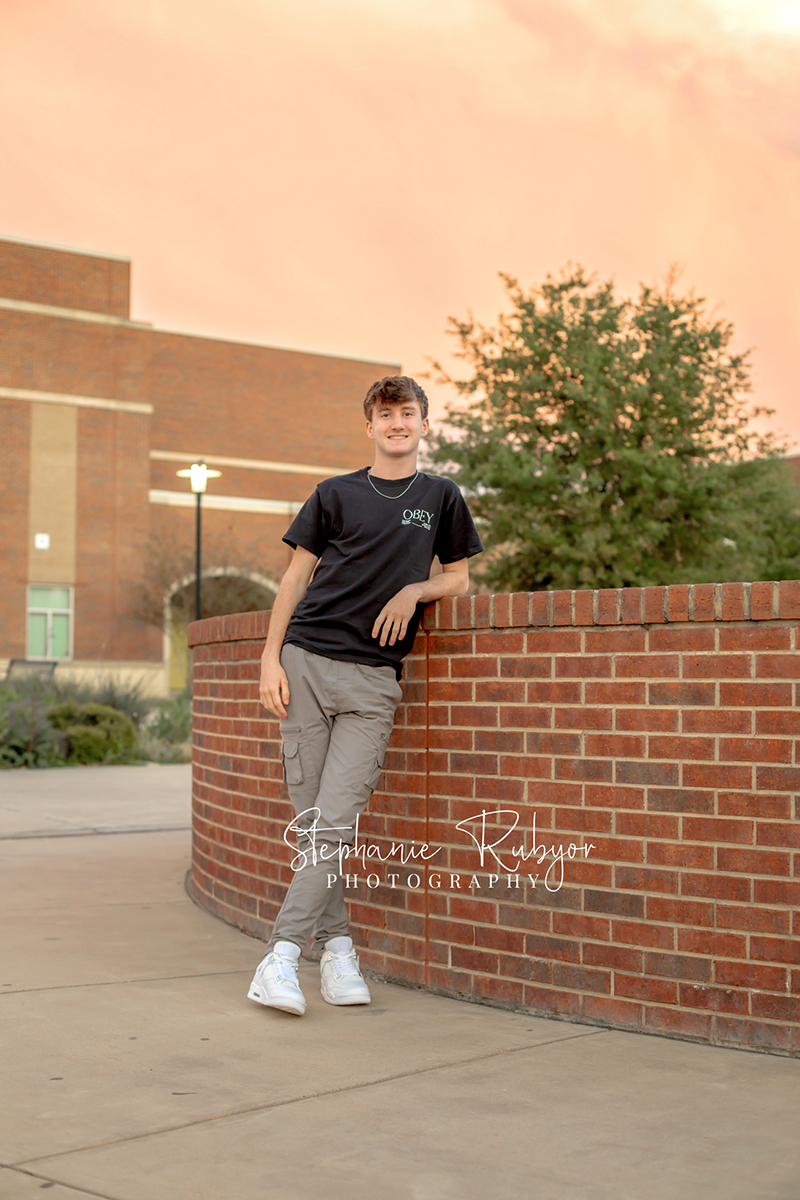 Brayden posing at Eaton High School in Haslet, Texas for his senior photo session. 