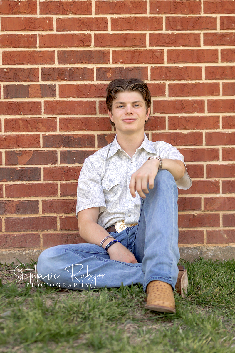 TJ having his senior pictures taken in the spring at Eagle Mountain Lake in Texas. 