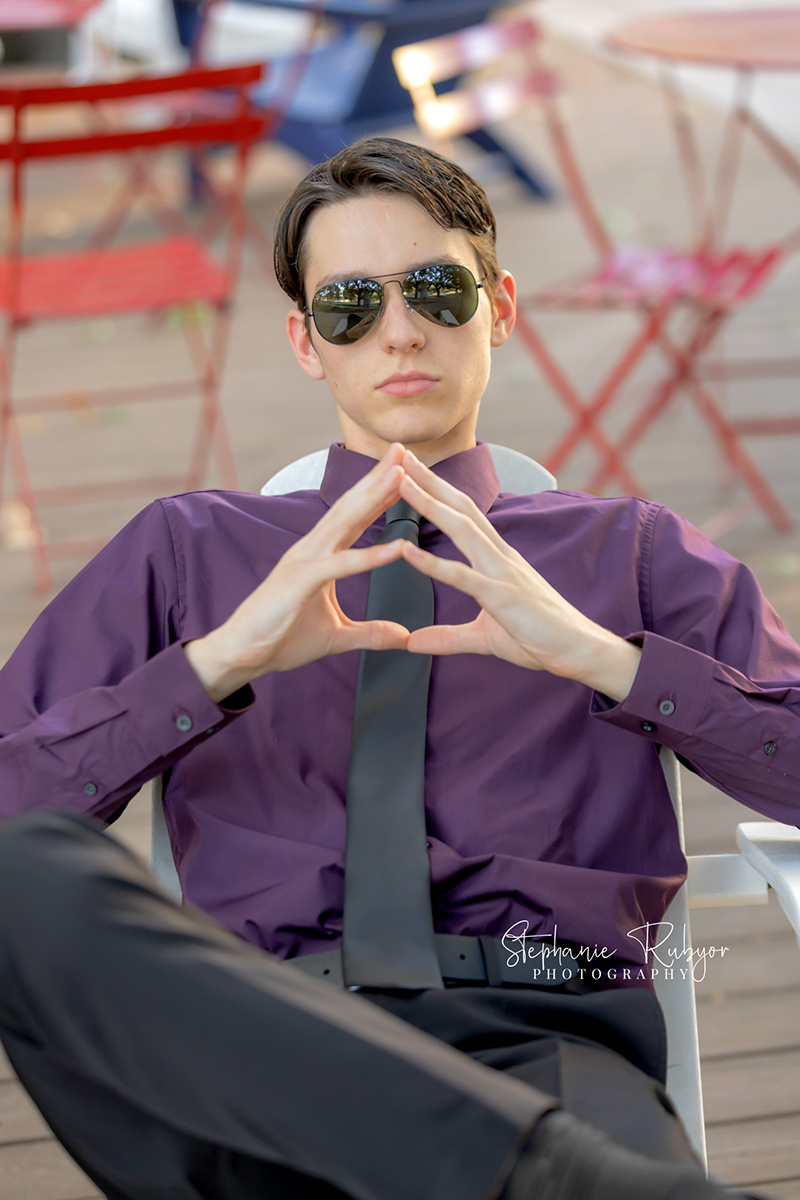 High school senior posing for Homecoming pictures at Burnett Park in Fort Worth. 
