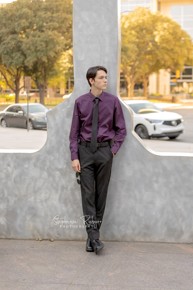 High school senior posing for Homecoming pictures at Burnett Park in Fort Worth. 