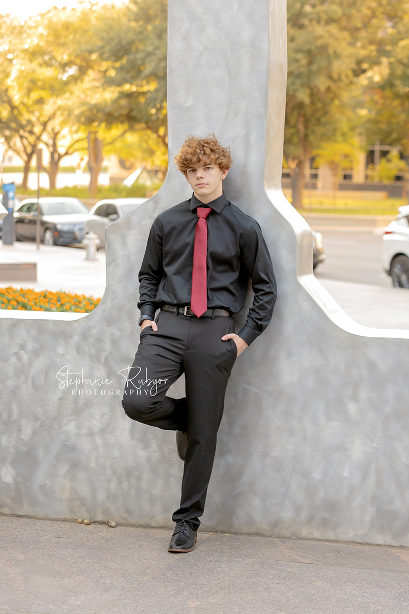 High school senior posing for Homecoming pictures at Burnett Park in Fort Worth. 