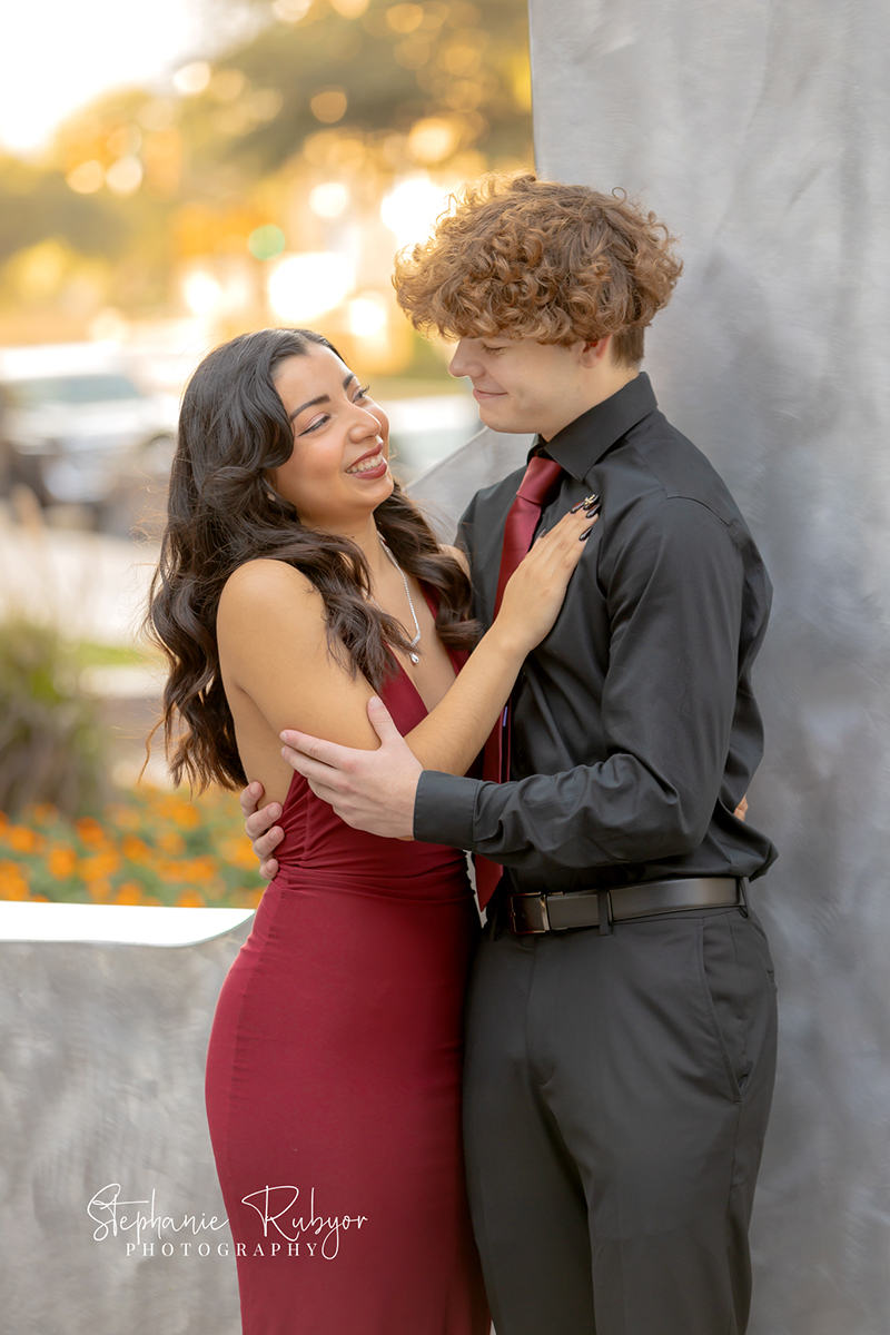 High school senior posing for Homecoming pictures at Burnett Park in Fort Worth. 