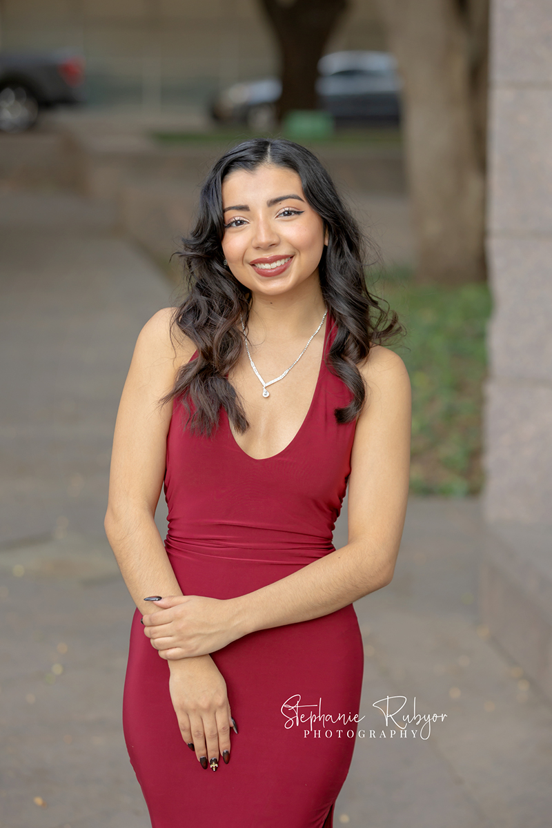 High school senior posing for Homecoming pictures at Burnett Park in Fort Worth. 