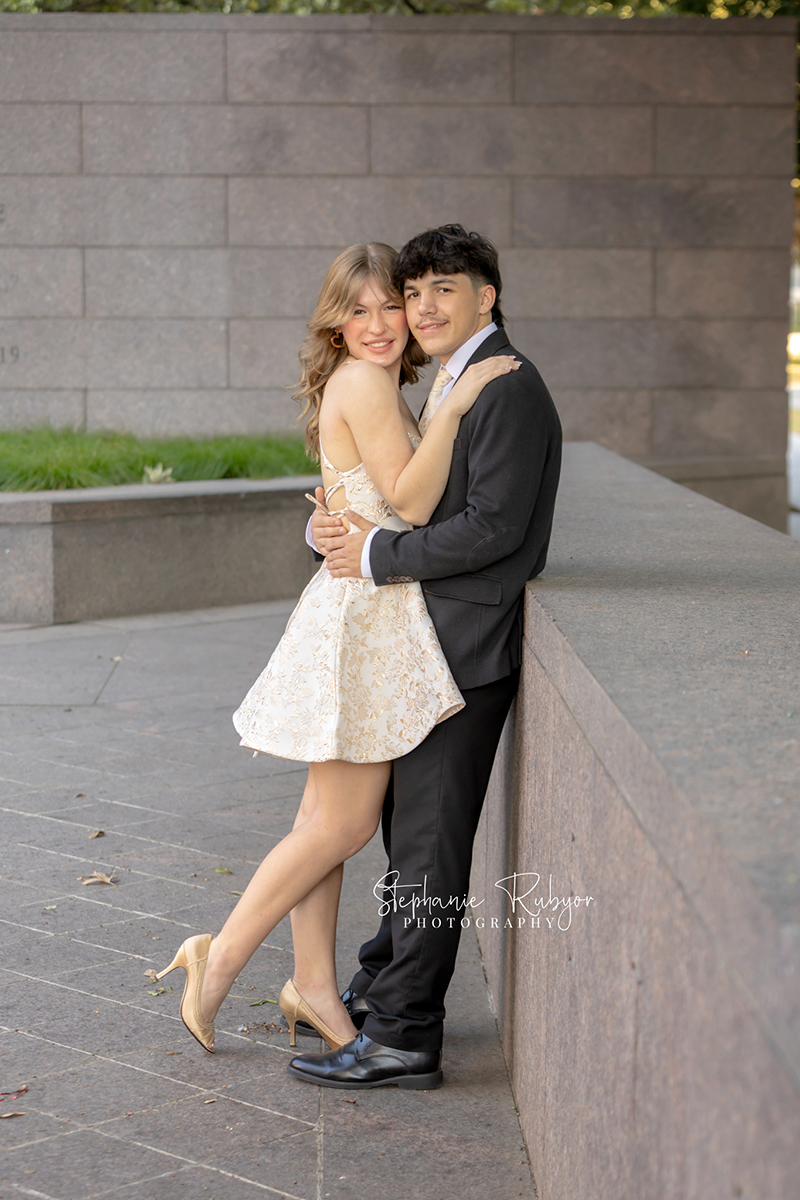 High school senior posing for Homecoming pictures at Burnett Park in Fort Worth. 