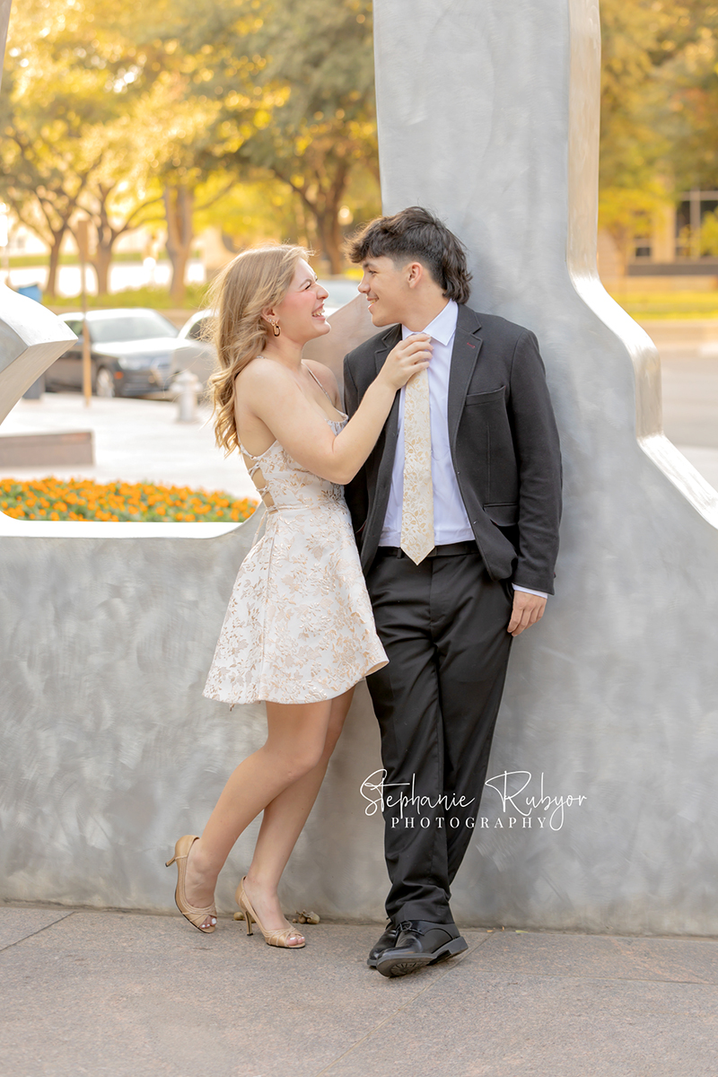 High school senior posing for Homecoming pictures at Burnett Park in Fort Worth. 