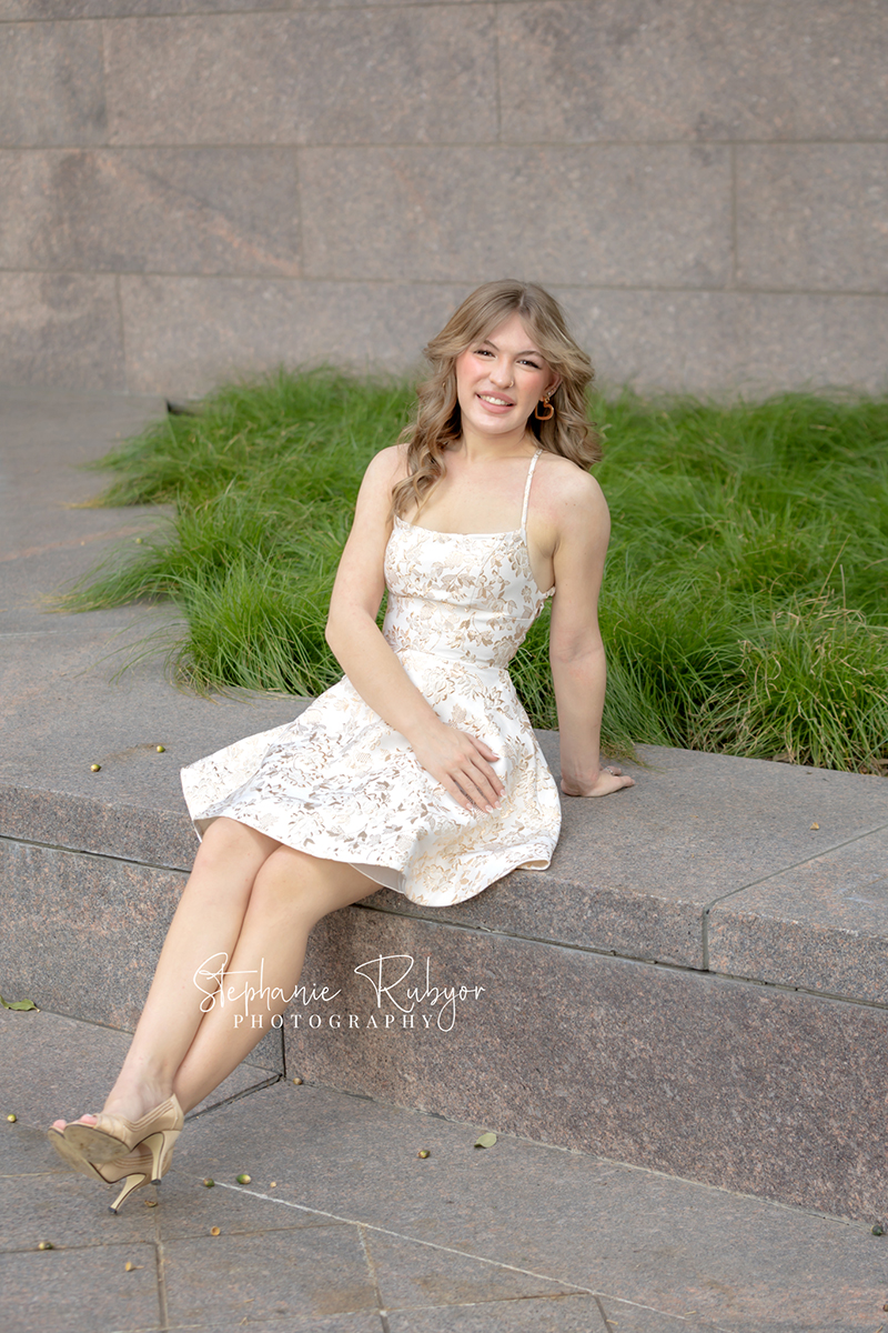 High school senior posing for Homecoming pictures at Burnett Park in Fort Worth. 