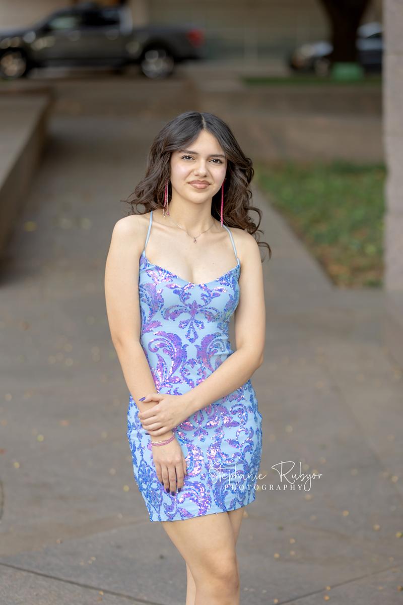 High school senior posing for Homecoming pictures at Burnett Park in Fort Worth. 