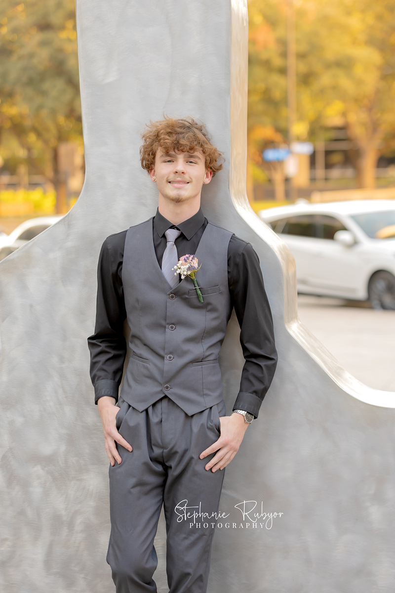 High school senior posing for Homecoming pictures at Burnett Park in Fort Worth. 