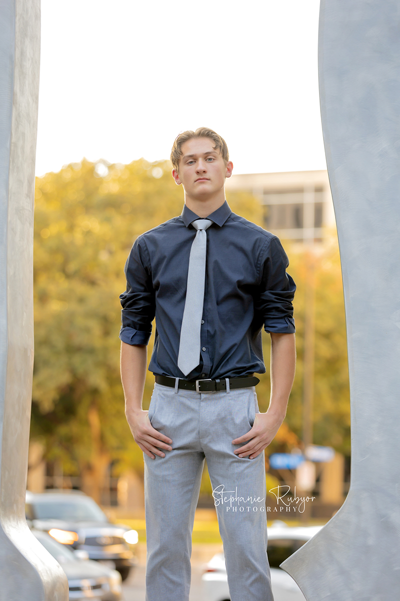 High school senior posing for Homecoming pictures at Burnett Park in Fort Worth. 