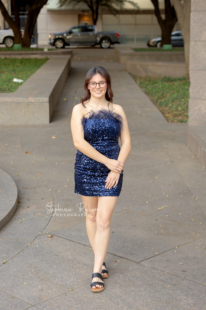 High school senior posing for Homecoming pictures at Burnett Park in Fort Worth. 
