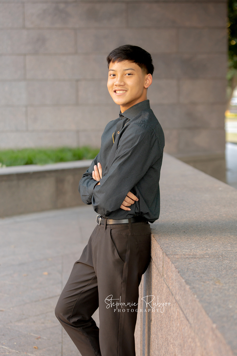 High school senior posing for Homecoming pictures at Burnett Park in Fort Worth. 